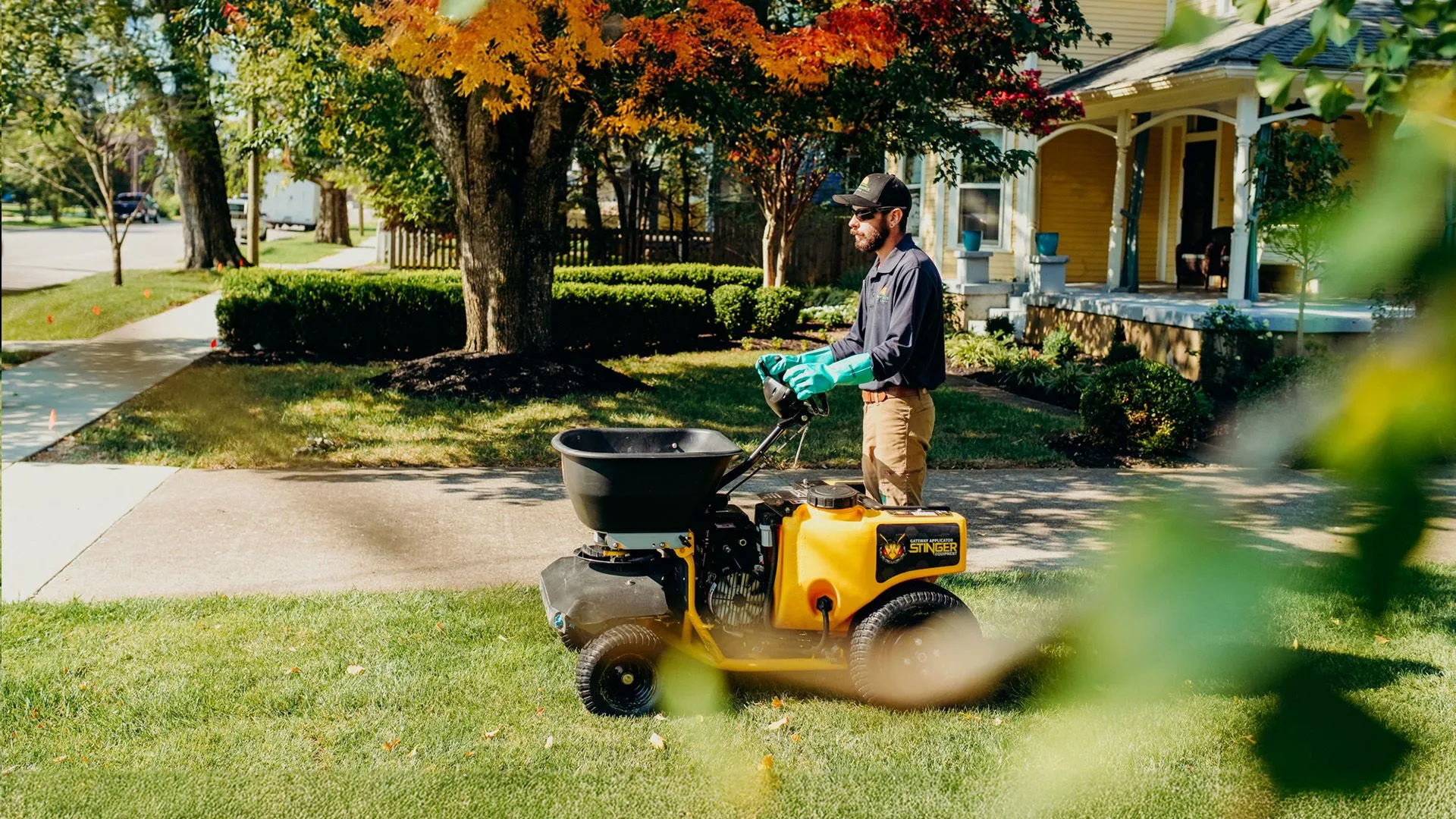 Performance Lawns Inc. Worker Mowing Lawn in Gallatin, TN.