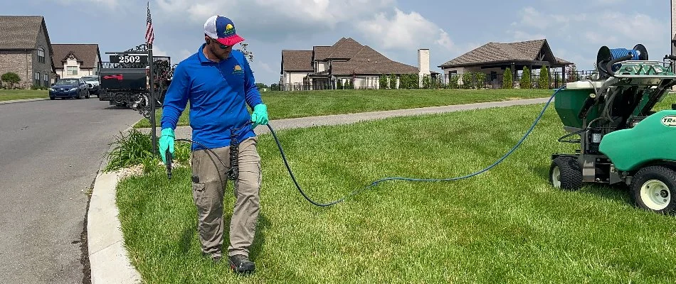 Spot-treating a lawn with post-emergent weed control in Gallatin, TN.